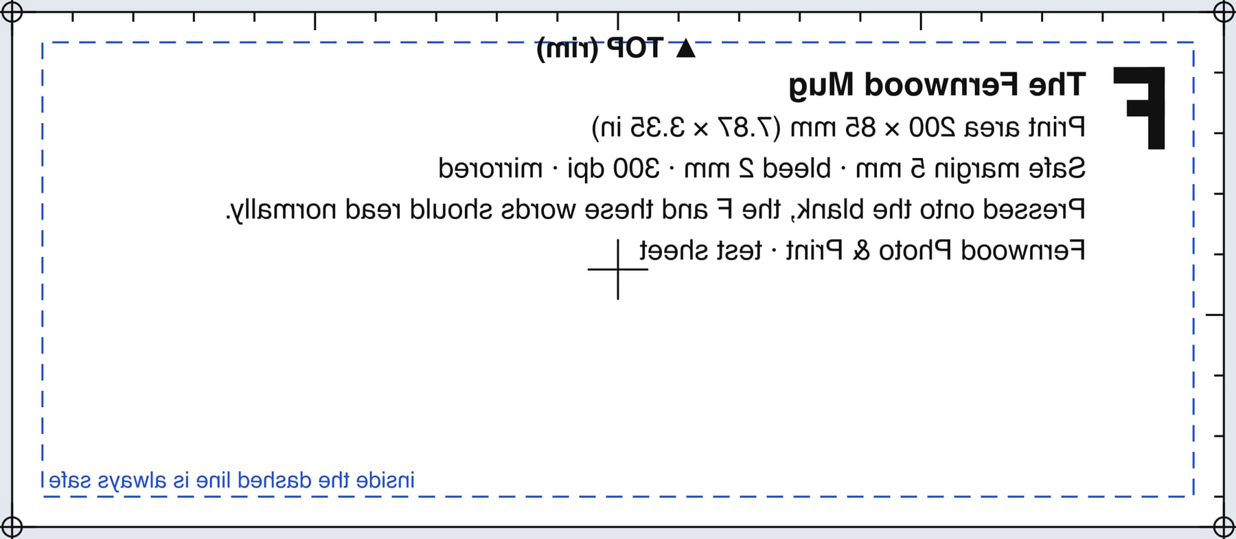 A test sheet, mirrored: a rectangle with millimetre tick marks along the top and left, registration marks at the corners, a dashed safe-margin line, a backwards letter F, and backwards lines of text giving the product name, the print area in millimetres and inches, and the press settings