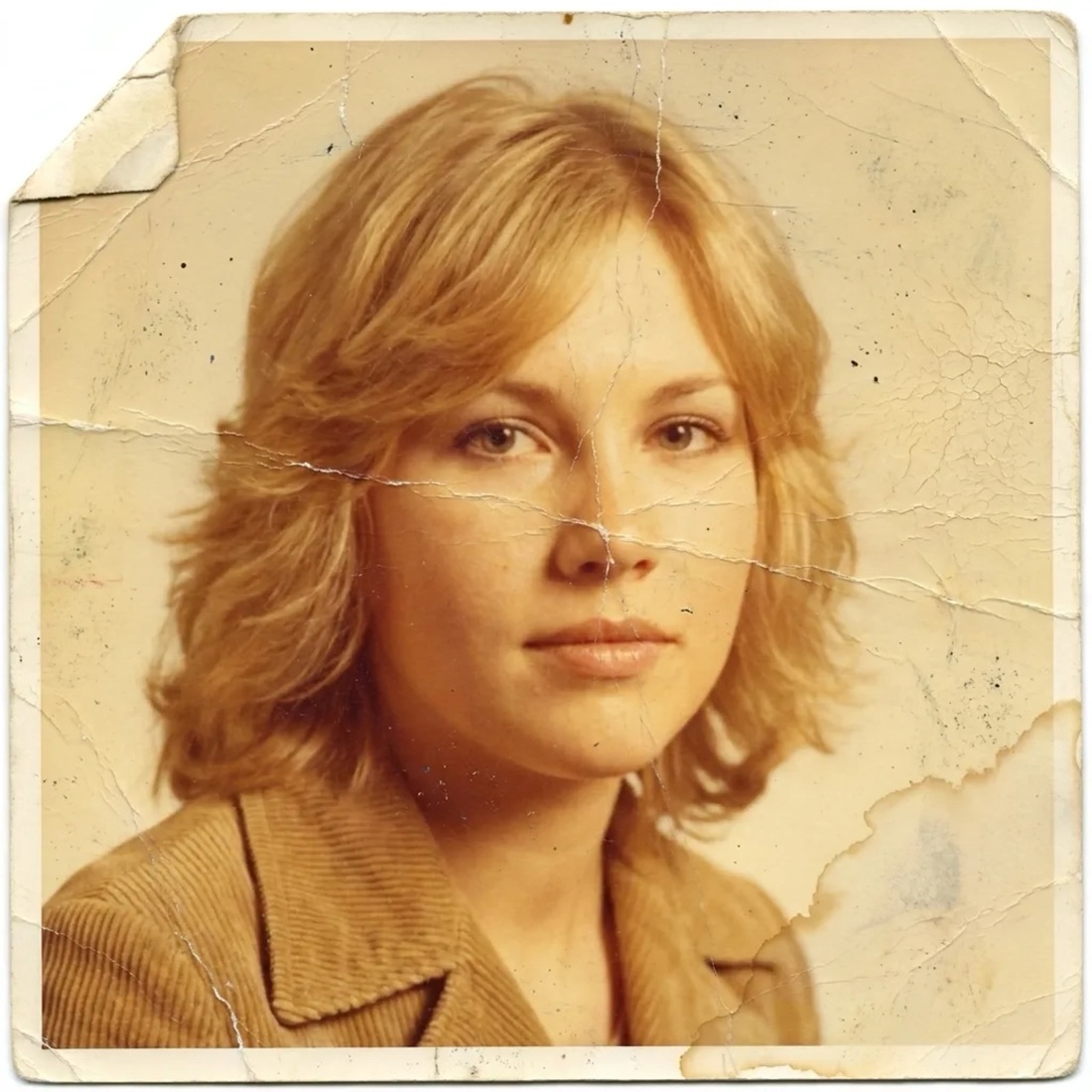 Damaged 1970s portrait print: creased, torn corner, water stain, faded color